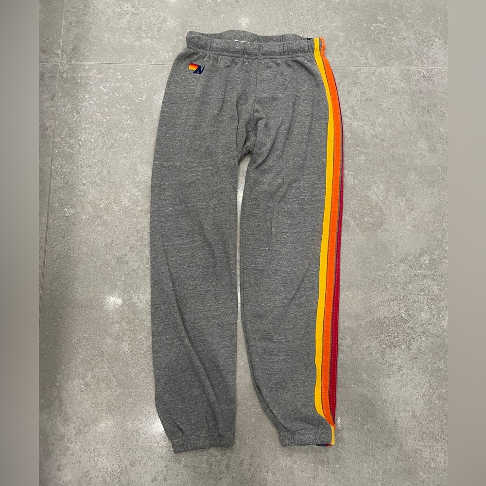 Aviator Nation gray sweatpants w/ signature multicolor five stripe down left leg